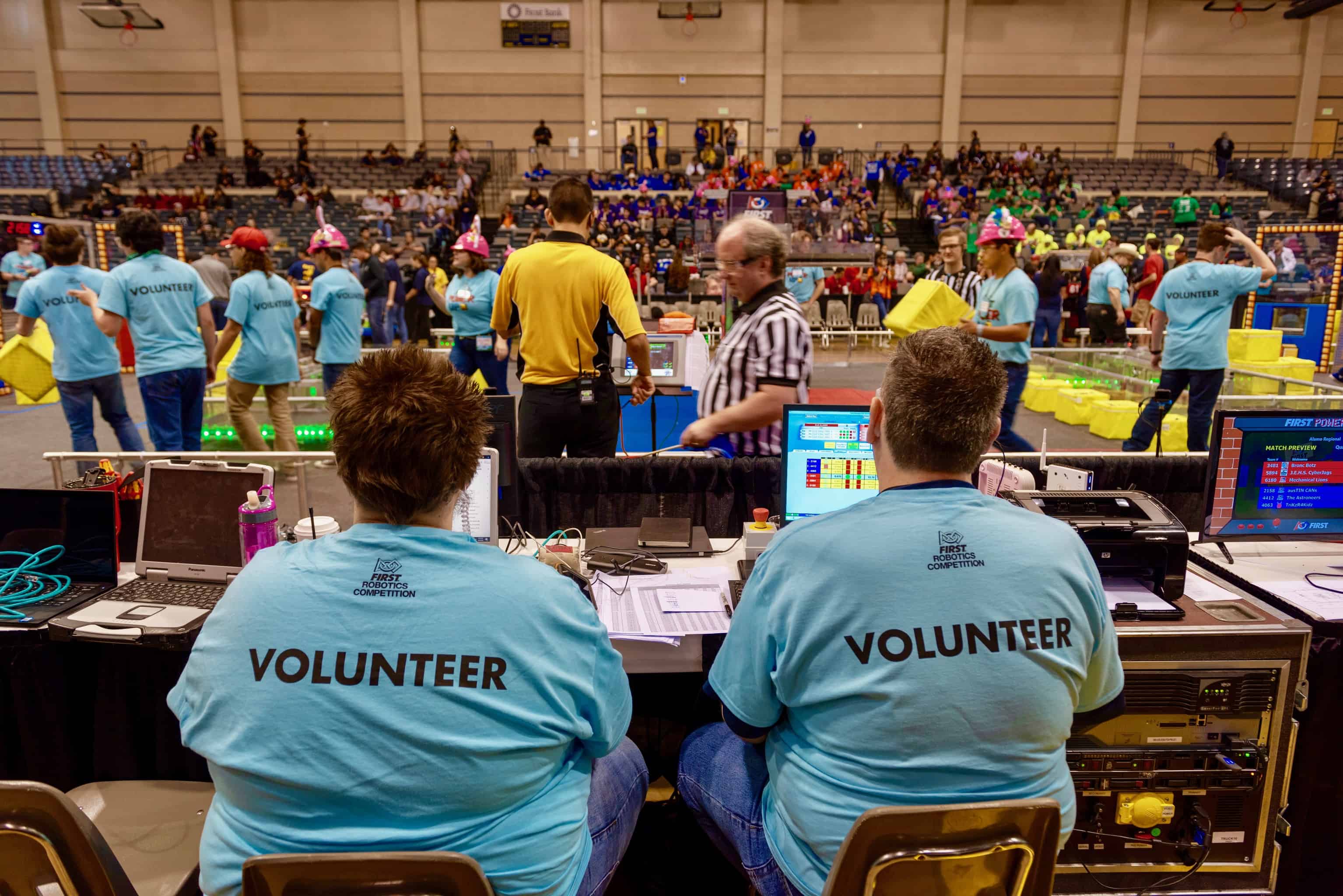 Volunteers resetting the FRC Field at a robotics event